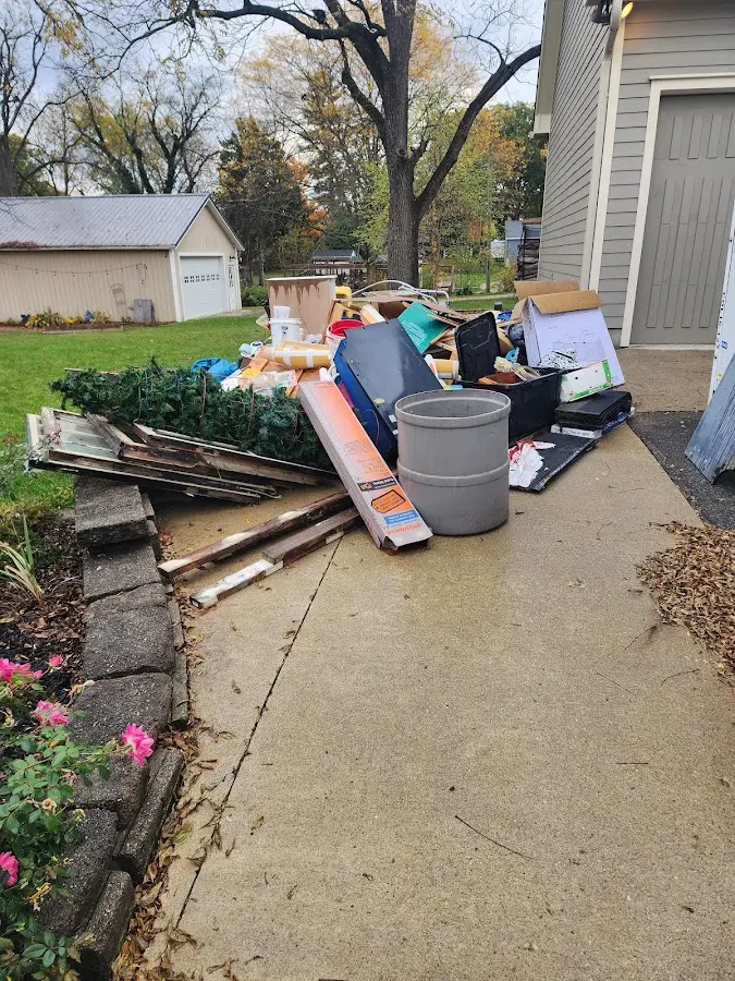 Dumpster being loaded with debris for Commercial Dumpster Rental in Maurice
